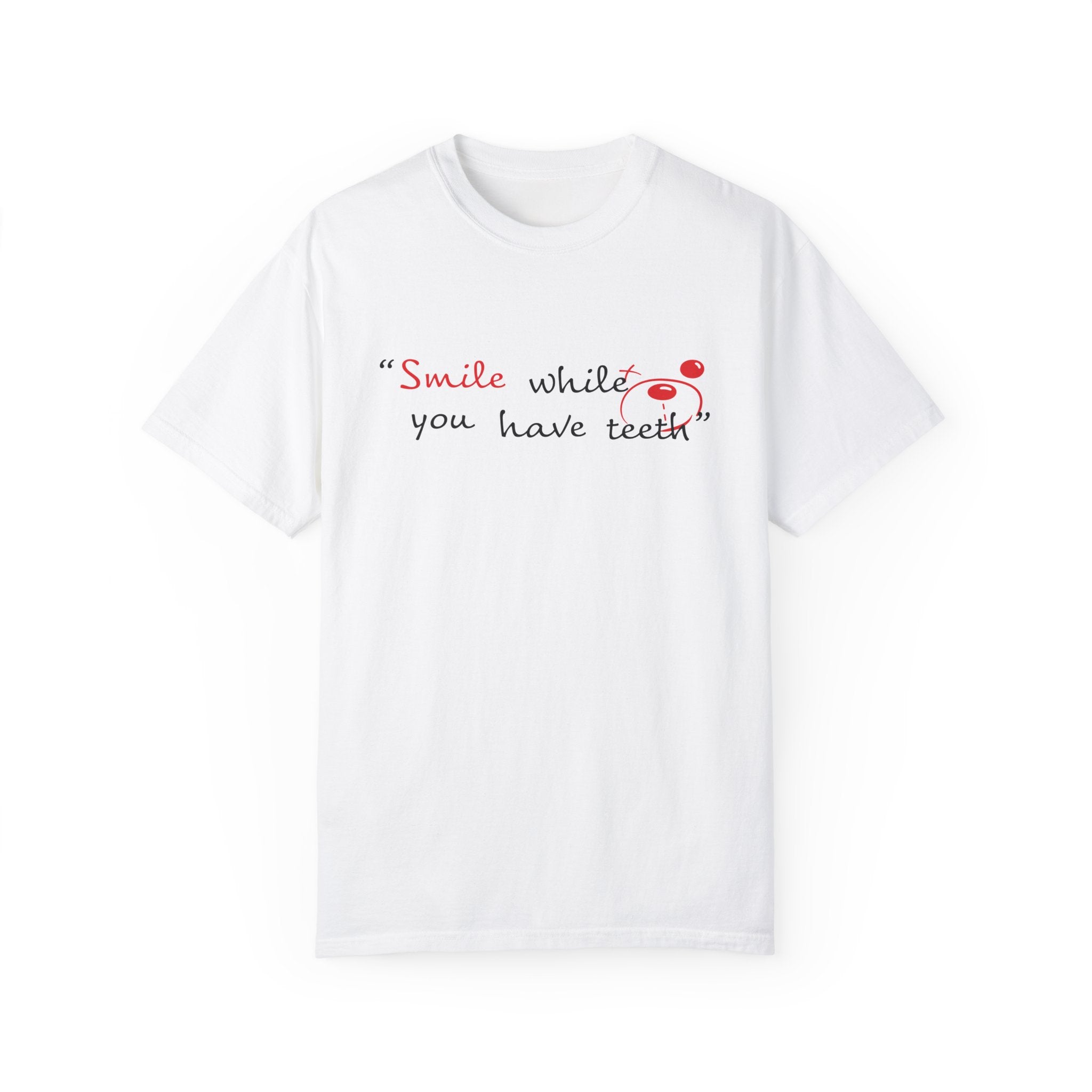 The Printify Just Smile Tee is a white t-shirt made from ethically grown cotton, featuring "Smile while you have teeth" in black and red with a red smiley face next to "teeth.