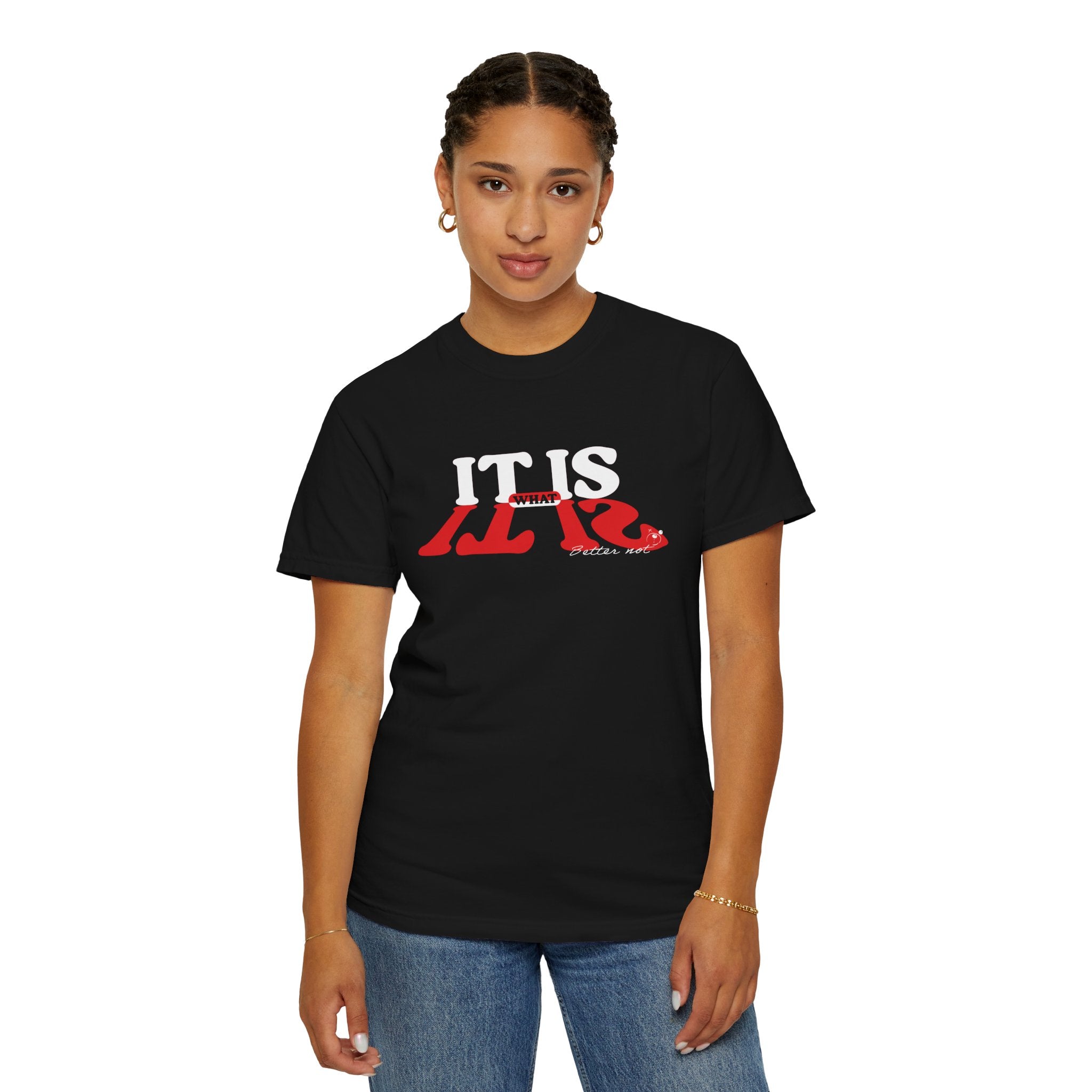 Someone wearing a Printify "It Is What It Is Tee" in black, made from 100% US cotton by Comfort Colors, featuring bold white and red text.