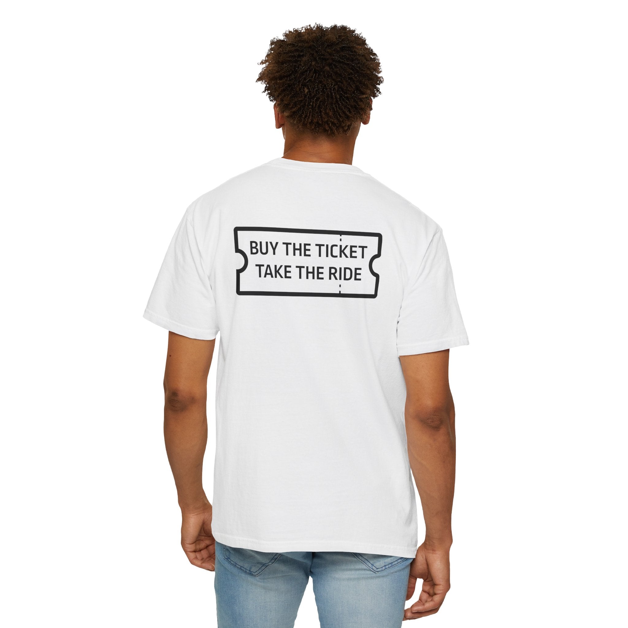 Someone is wearing Printify's "Buy The Ticket Tee," a white Comfort Colors 1717 shirt made from 100% US cotton, featuring "BUY THE TICKET TAKE THE RIDE" on the back, paired with blue jeans for a relaxed look.