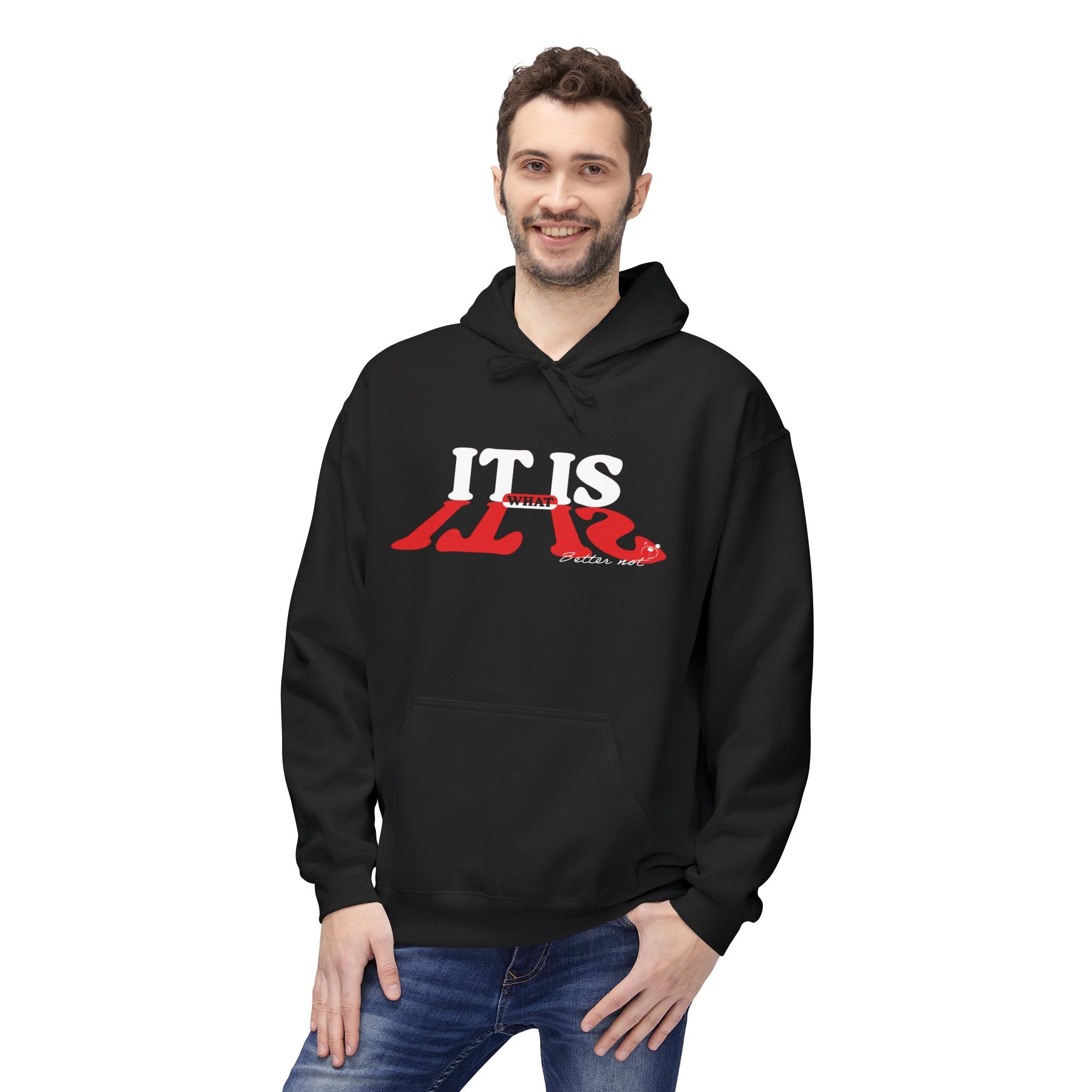 A man wearing a Printify "It Is What It Is" eco-friendly hoodie, featuring "IT IS ALIVE" printed in white and red, stands smiling with one hand in his pocket.