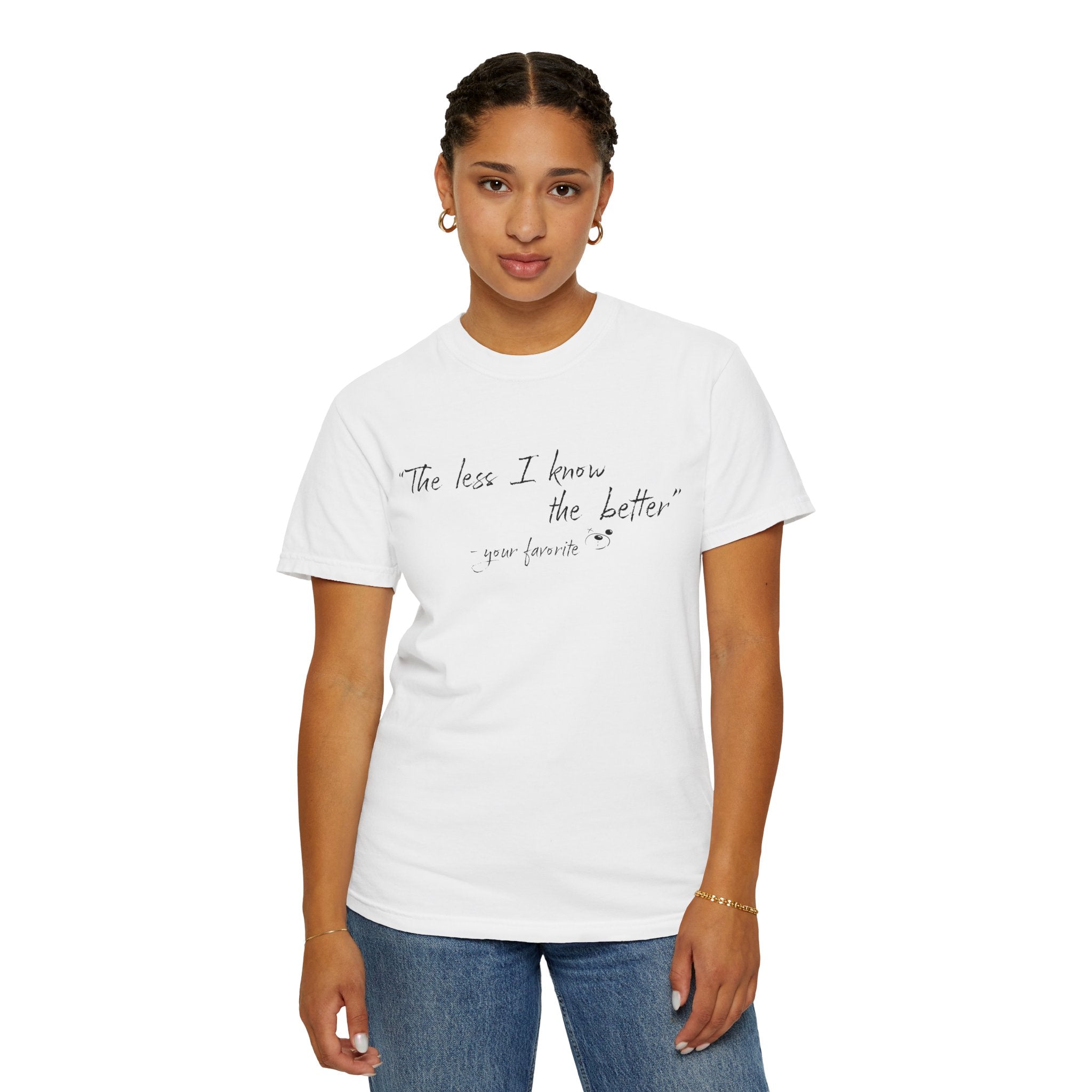A person faces the camera wearing The Less I Know Tee by Printify, featuring "The less I know the better - your favorite" in a handwritten style on a white Comfort Colors 1717 shirt for a relaxed, vintage look.
