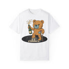 The Podium Bear Tee by Printify is a premium white T-shirt made from 100% US cotton, featuring a playful cartoon teddy bear on a podium with a champagne bottle and trophy.