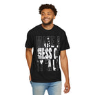 A man wearing a Printify Make A Mess Tee, crafted from soft US cotton and featuring the bold text "Make a Mess of It All," smiles while standing against a white background.