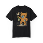 The Printify Podium Bear Tee showcases a cartoon bear on a winners' podium with a champagne bottle and crutch. Made from premium US cotton by Comfort Colors, this black t-shirt combines comfort and style in one striking design.