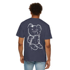 A person is wearing a navy blue Graffiti Bear Tee from Printify, made of 100% US cotton, featuring a white sketch-style bear design on the back.