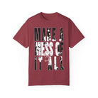 Printify's Make A Mess Tee is a red garment-dyed T-shirt crafted from ring-spun US cotton, featuring bold white and black text saying "Make A Mess Of It All" on the front.