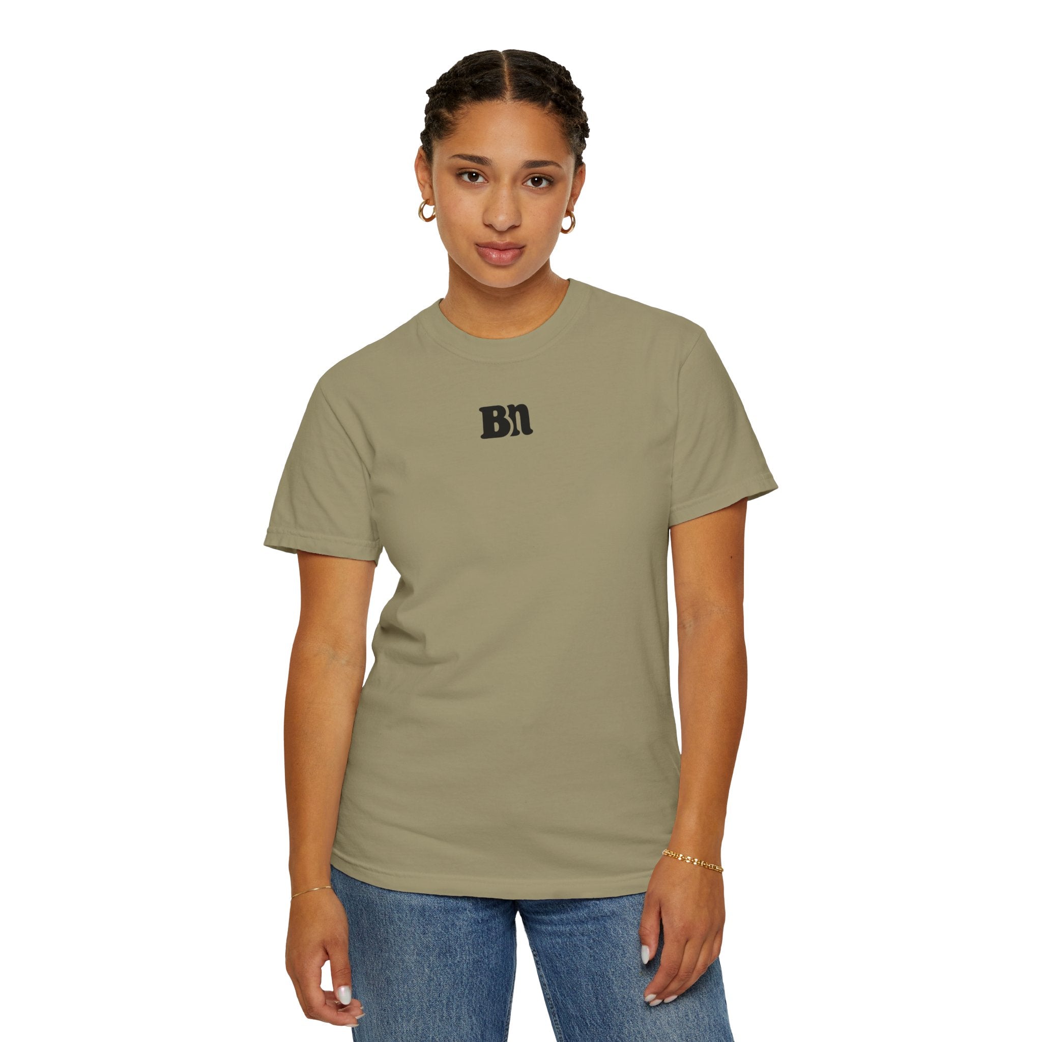 A person wearing a green Printify Bad Decisions Comfort Colors 1717 premium tee and blue jeans stands against a white background.