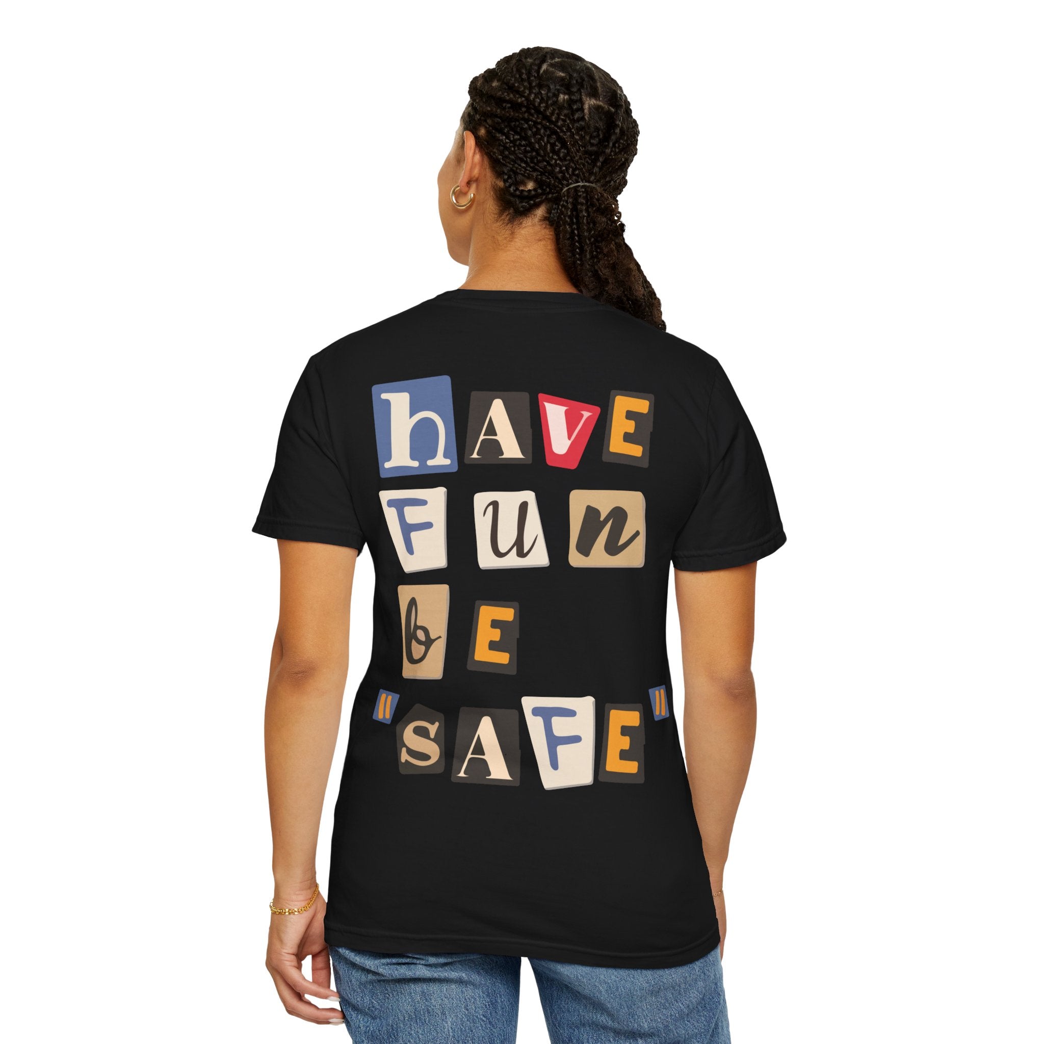 Someone wears the Printify "Have Fun Be 'Safe' Tee," a stylish black premium shirt featuring vibrant back text, "Have Fun Be Safe." Made from soft US cotton like the Comfort Colors 1717 line, it offers both comfort and flair.