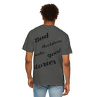 Wearing Printify's gray "Bad decisions Tee" made of 100% ring-spun cotton, the person flaunts "Bad decisions make good stories" boldly on the back. The garment-dyed Comfort Colors tee pairs perfectly with light blue jeans for a casual, stylish look.