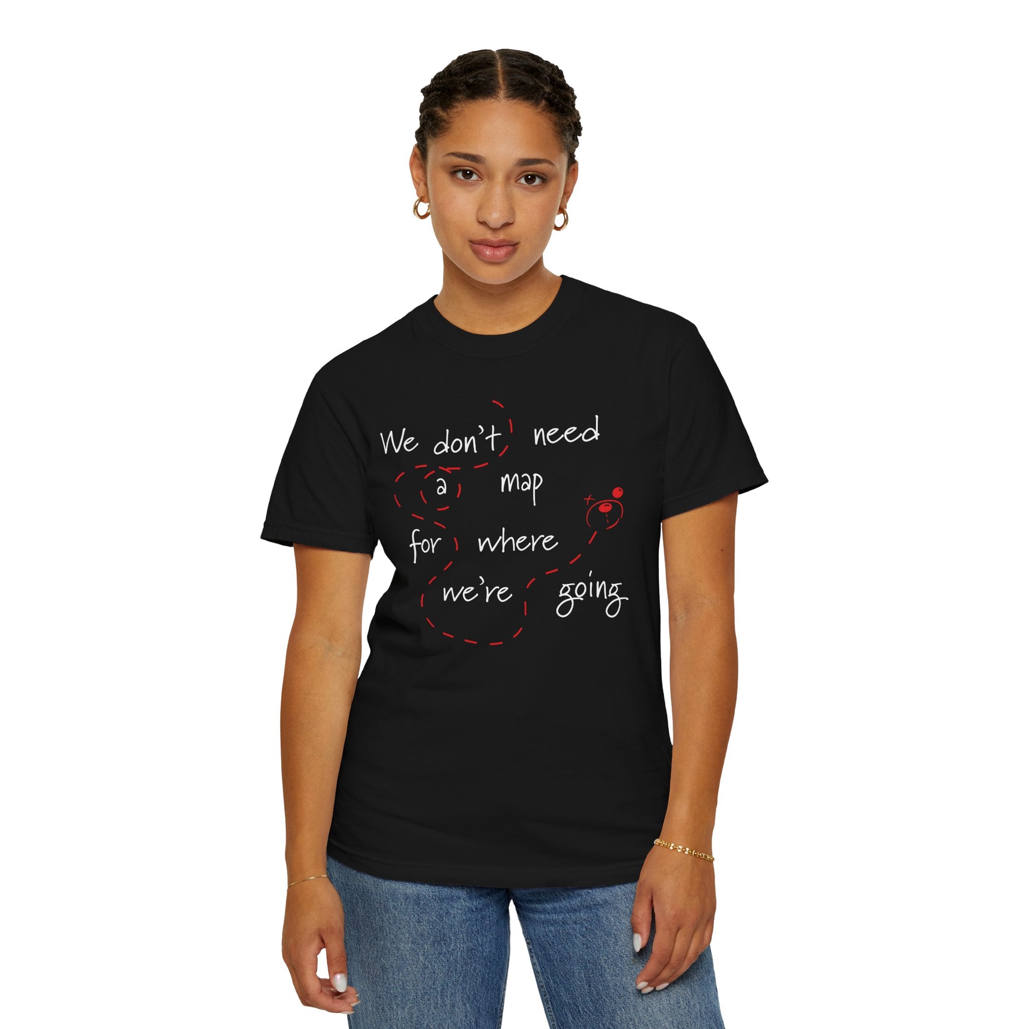A person stands facing forward wearing the Printify No Map Needed Tee, a relaxed fit black t-shirt with white and red text that says, "We don't need a map for where we're going.