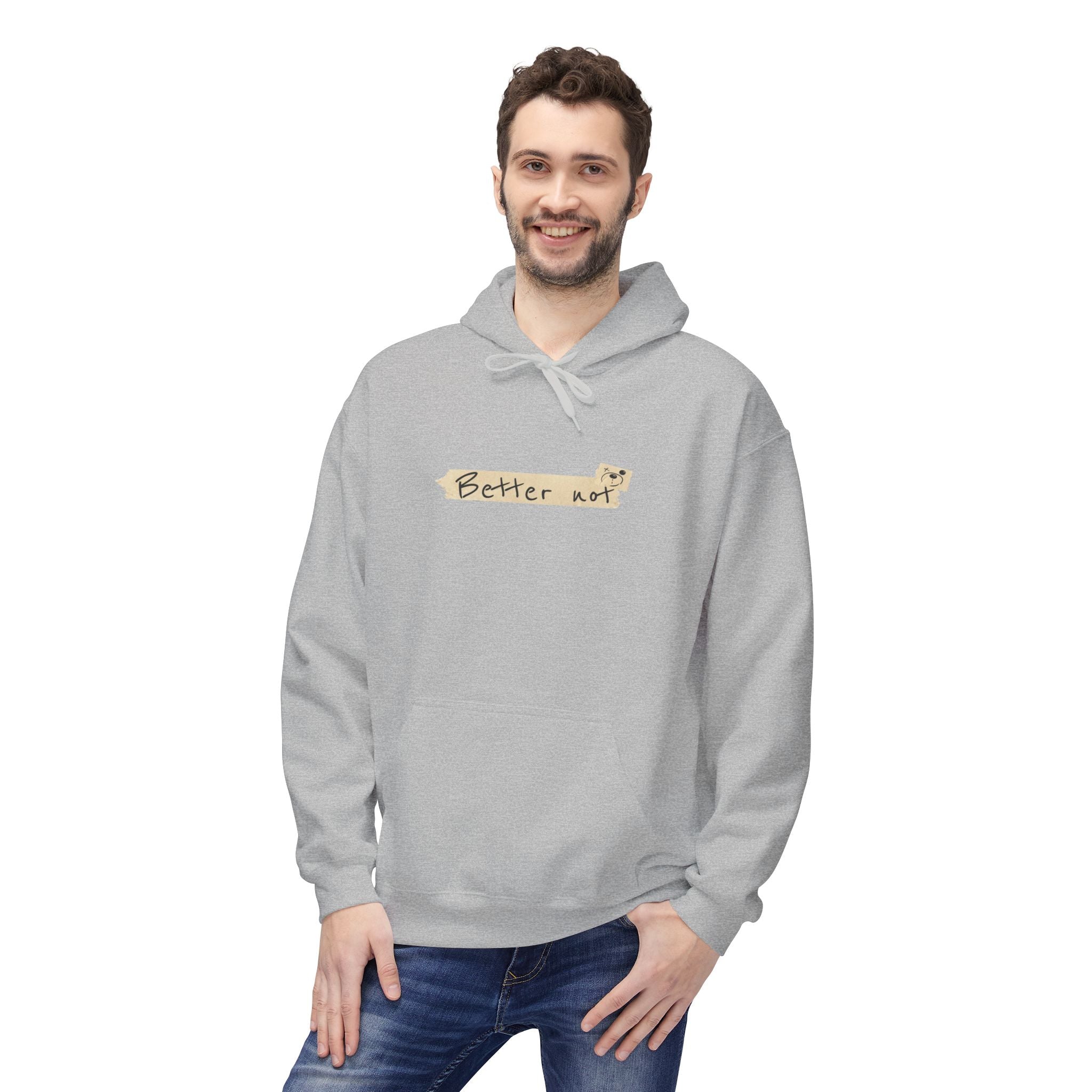 A person stands smiling in a gray "Note to Self" hoodie by Printify, with "Better not" on the front. The eco-friendly materials highlight its sustainable commitment, and they have one hand in a pocket.