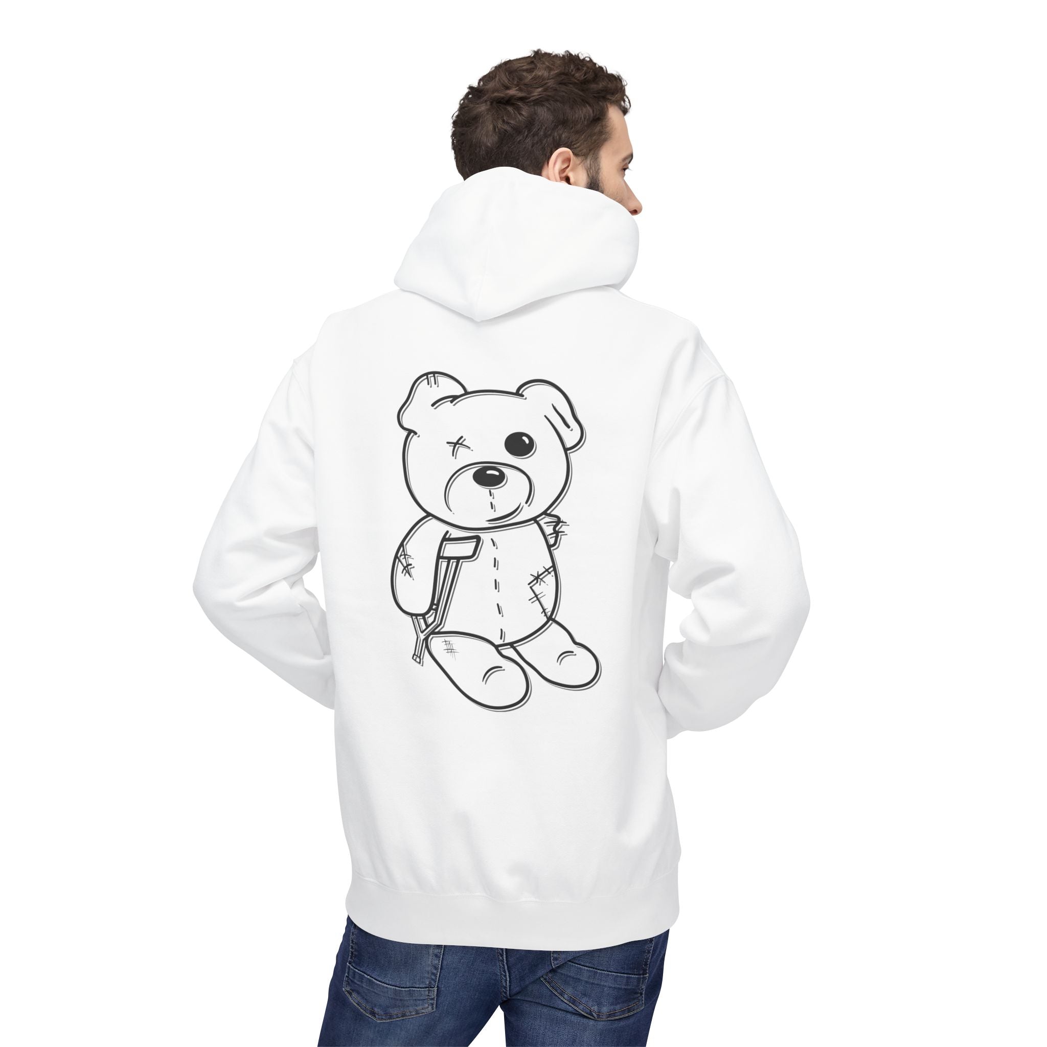 Sporting the Mascot Hoodie by Printify, featuring an eco-friendly cartoon teddy bear design, paired with blue jeans, highlights a commitment to sustainable fashion.