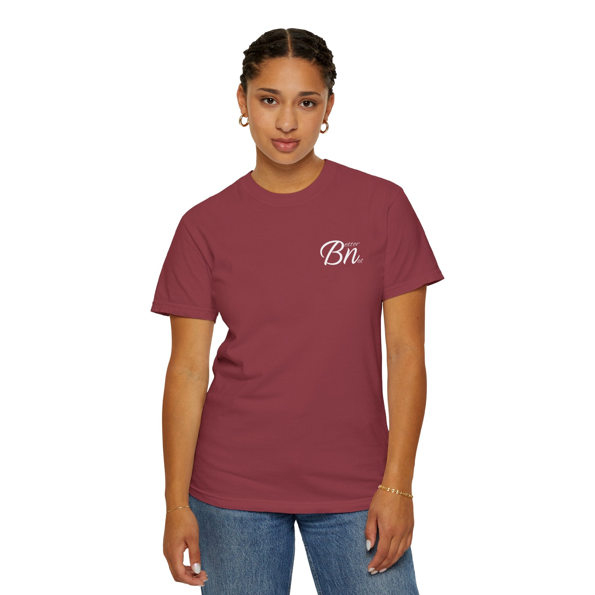 A person in a maroon Printify 'The Script Tee', crafted from 100% US cotton, with a small white chest logo, is paired with blue jeans against a plain white backdrop.