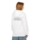 A person wearing Printify's "The Good Time Hoodie," a sustainable white hoodie with "If lost: please direct to the nearest good time" on the back, stands against a plain background.