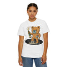 Someone wears the Podium Bear Tee from Printify, crafted from 100% US cotton, showcasing a cartoon bear with a champagne bottle on a podium.