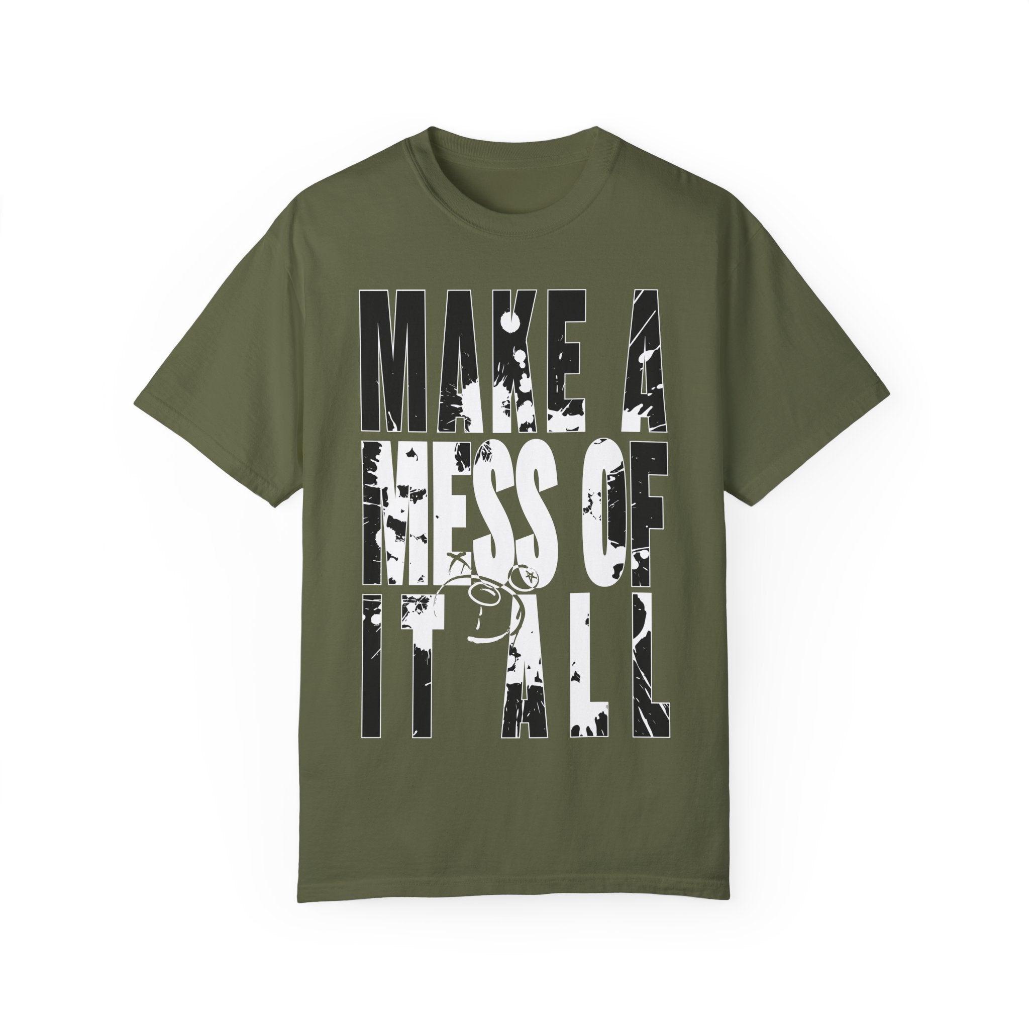 The Make A Mess Tee by Printify, made from 100% US cotton, is a green shirt with bold, distressed white text reading "MAKE A MESS OF IT ALL.