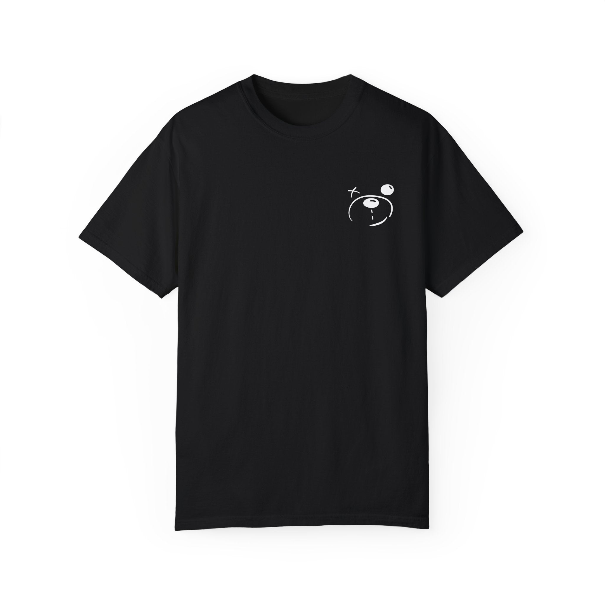 The Grin & Bear It Tee by Printify is crafted from 100% US cotton, showcasing a black fabric with a small white graphic of a face and celestial elements on the upper chest. Inspired by Comfort Colors 1717 standards, it blends style and ultimate softness.