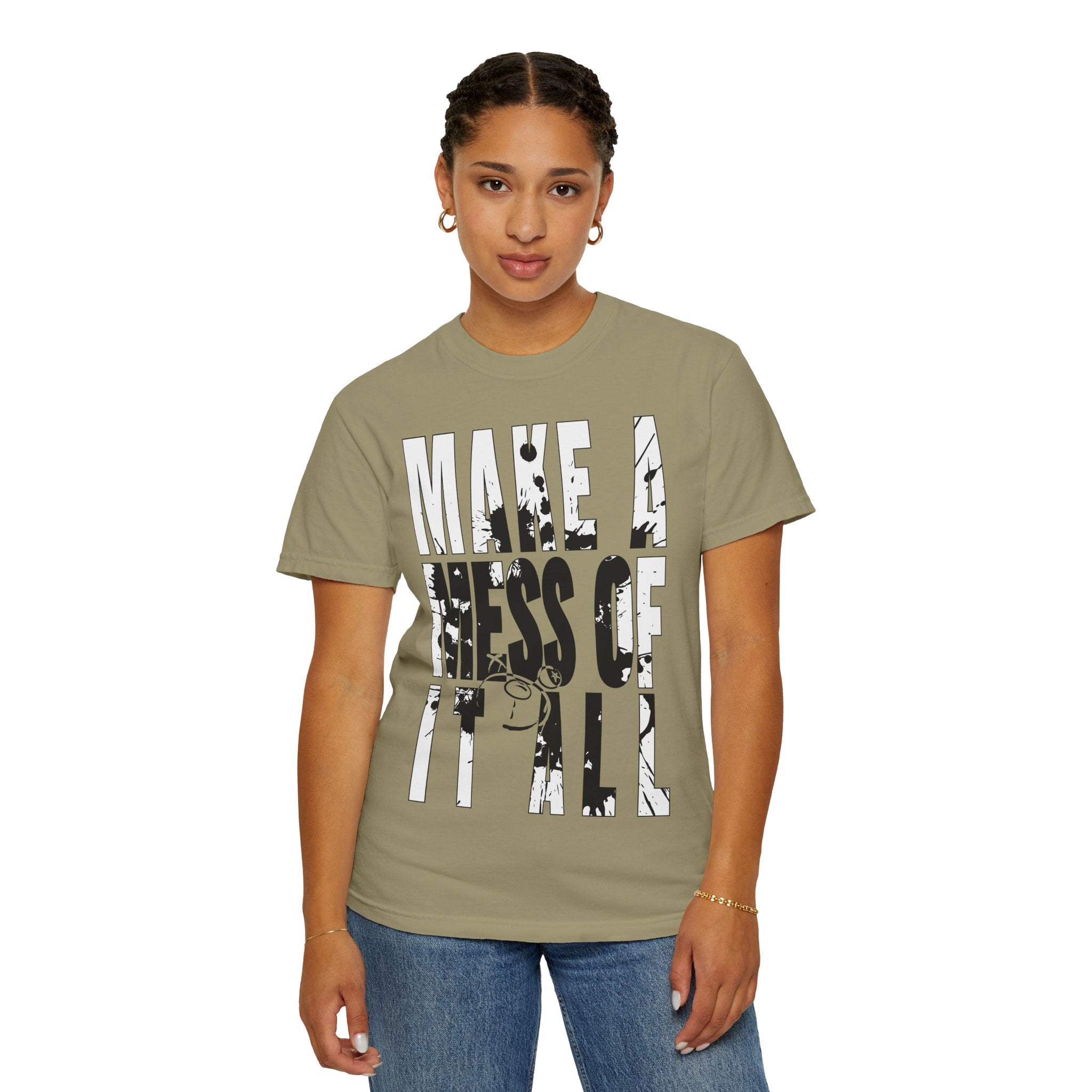 A person wearing a Printify Make A Mess Tee with "Make a Mess of It All" in stylized text stands against a plain background, highlighting the relaxed fit and softness of US cotton.