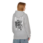 A person in a Printify gray "Make A Mess Hoodie," ethically made with "Make a Mess of It All" on the back, stands against a white background.