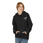 A person donning the Grin & Bear It Hoodie by Printify stands against a plain white background, highlighting sustainable apparel made in a WRAP-certified facility.