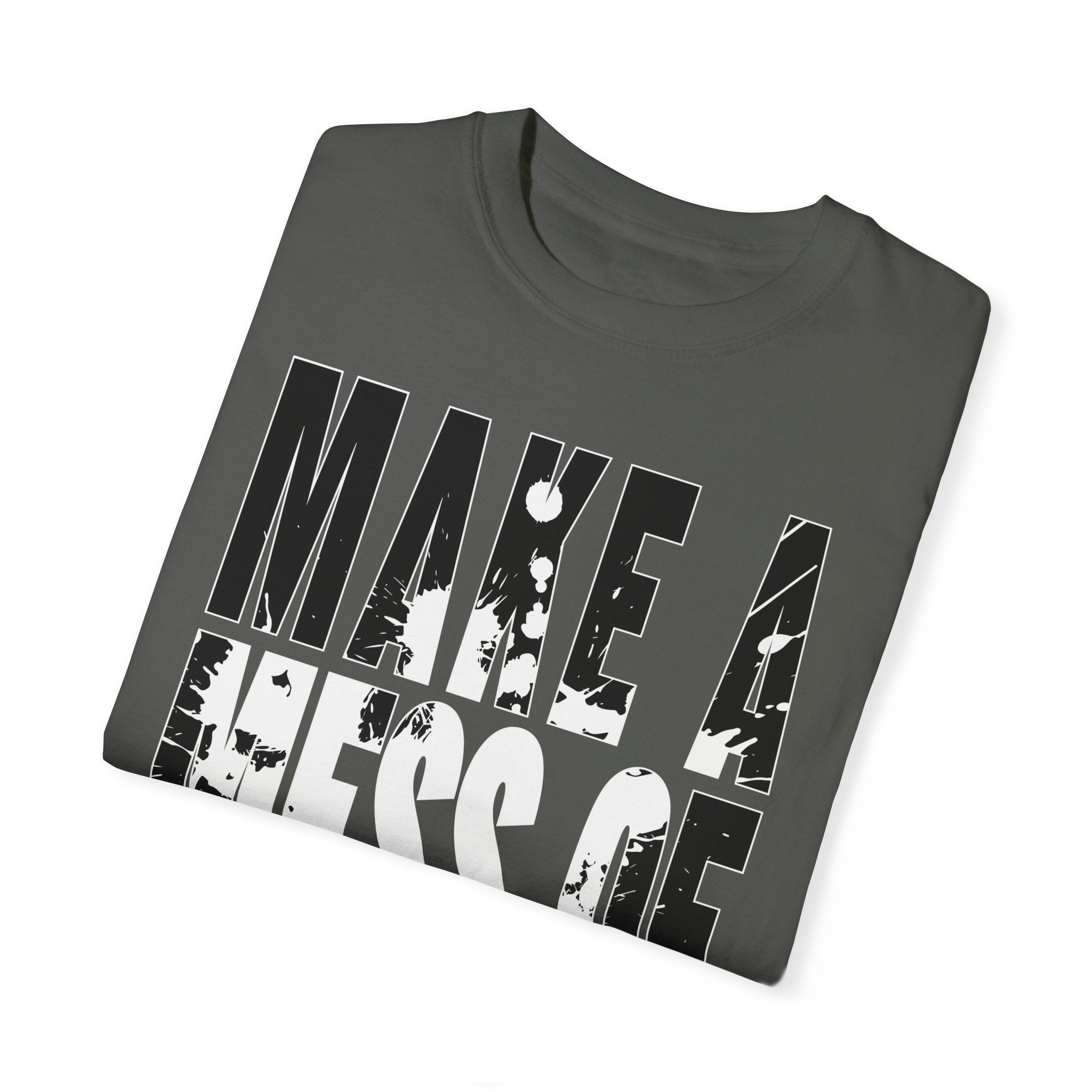 The Make A Mess Tee by Printify is a folded dark gray shirt with bold, distressed white text "MAKE A MESS OF," crafted from soft US cotton for a relaxed fit.