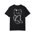 The Graffiti Bear Tee by Printify is a black Comfort Colors 1717 T-shirt with a white sketch of a distressed teddy bear on the back, made from ethically grown cotton for premium comfort.