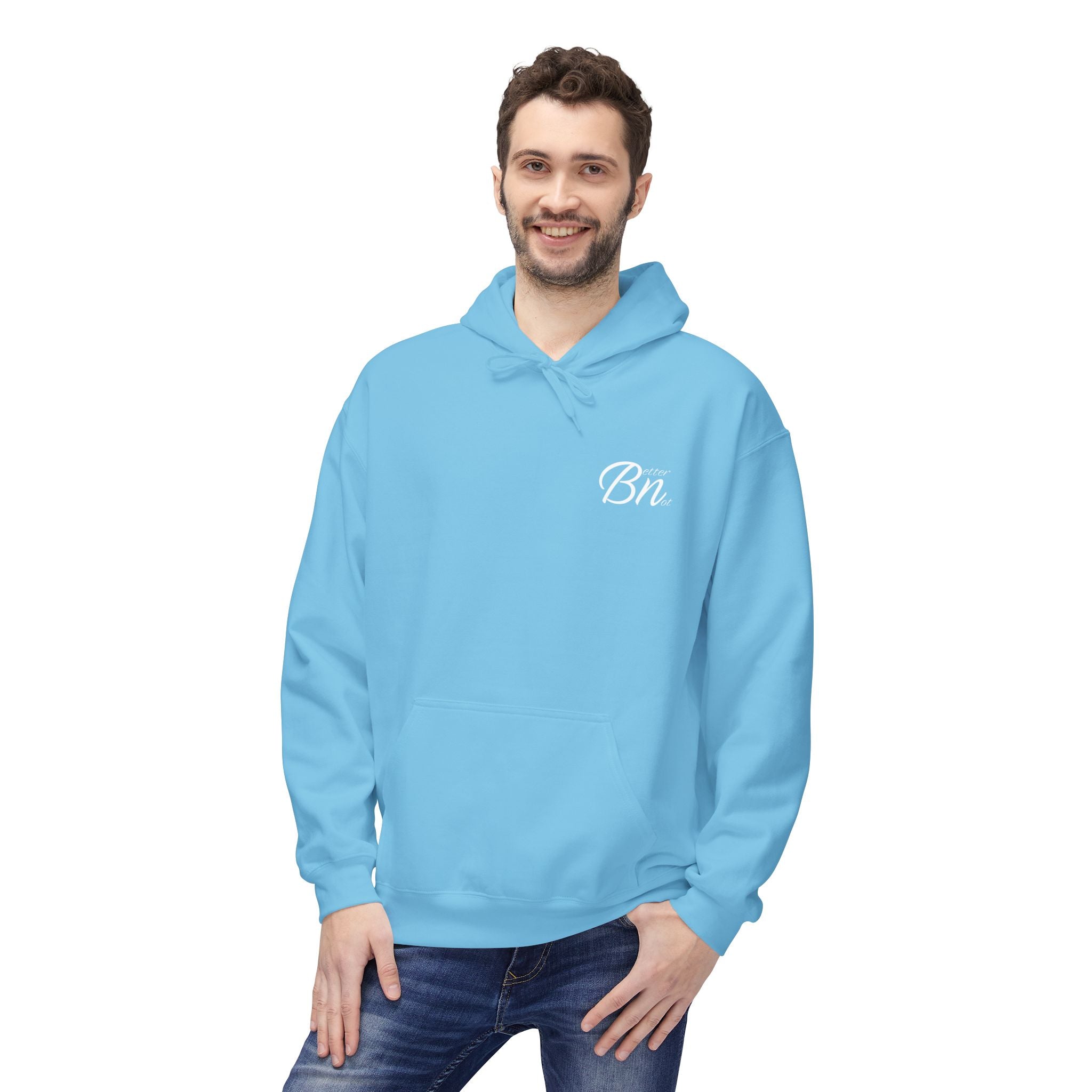 A person wearing Printify's The Script Hoodie in eco-friendly light blue, featuring a "Bn" on the chest, smiles with one hand in their jeans pocket.