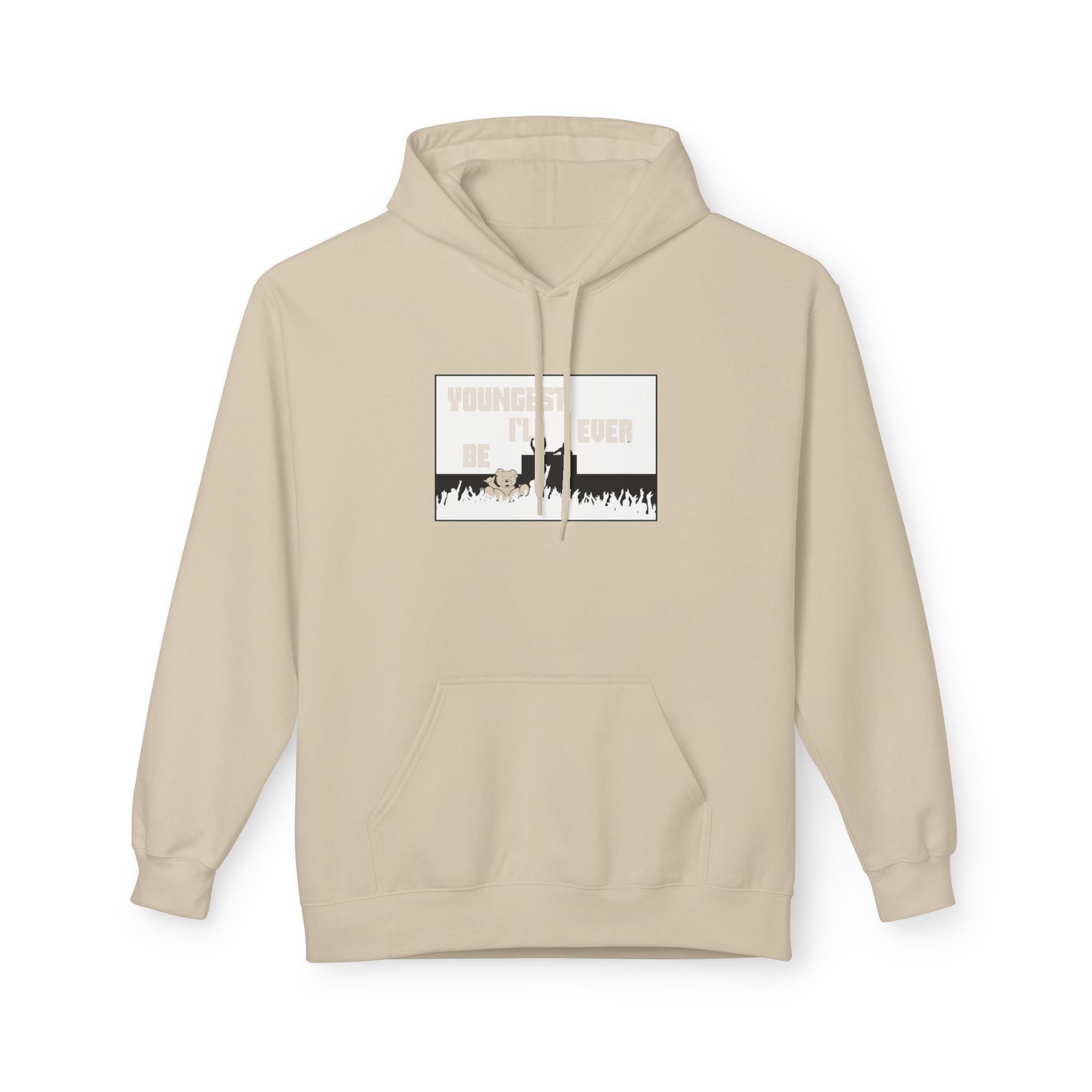 The "Live Young Hoodie" by Printify is a beige hoodie with a graphic reading "YOUNGEST I'LL EVER BE" above a silhouette and crowd, crafted from eco-friendly materials to combine style and sustainability for conscious consumers.