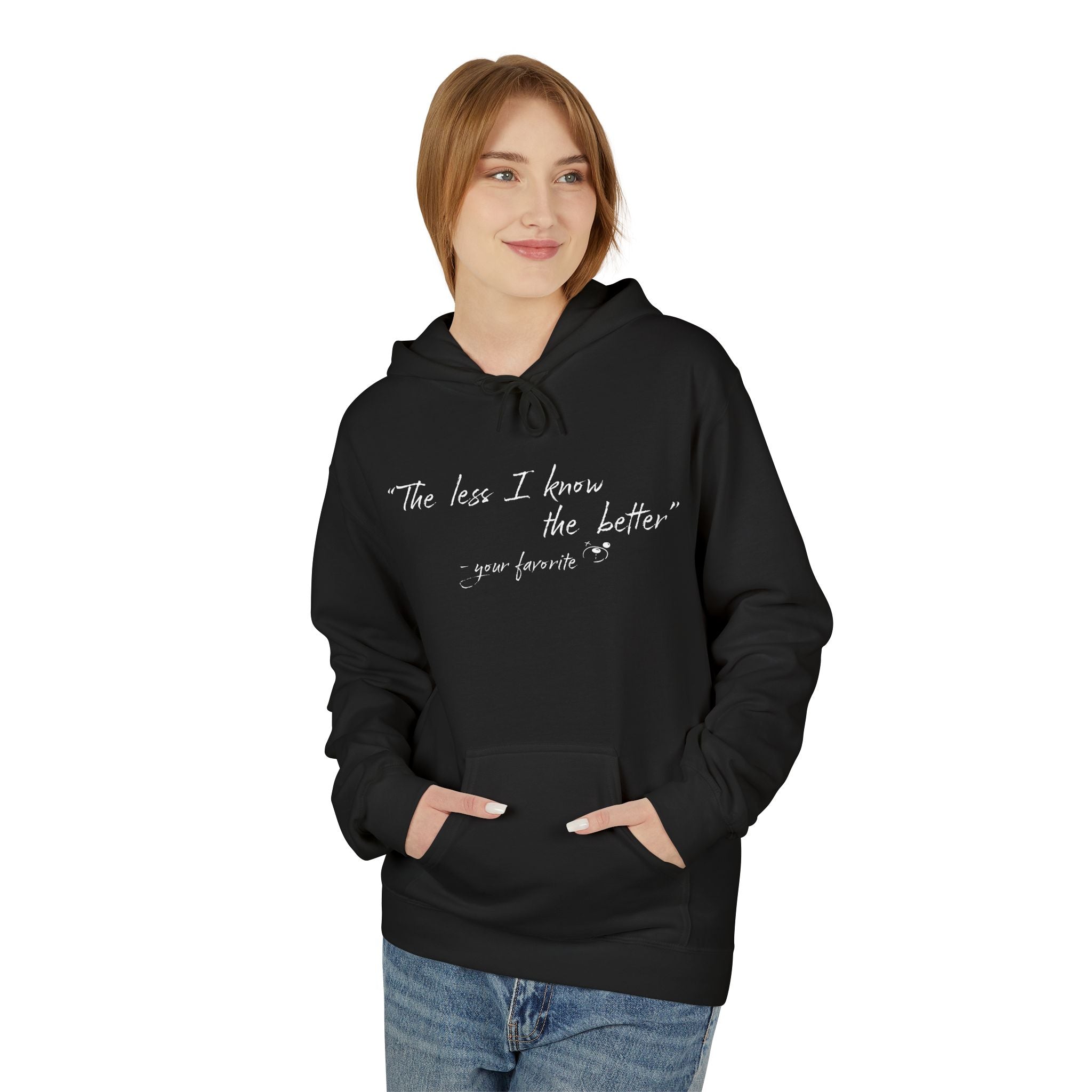 A person wears Printify’s The Less I Know Hoodie in black, featuring white text: "The less I know the better - your favorite," and stands with hands in the front pocket.