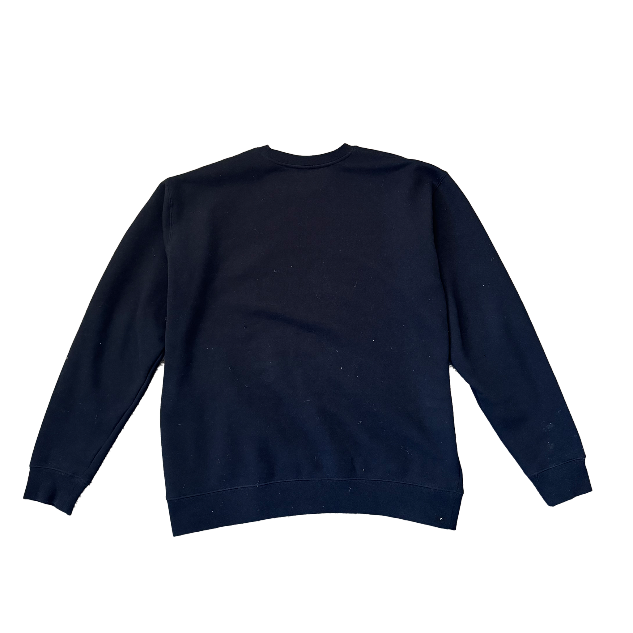 Staple Crew in navy blue made from premium ring-spun cotton, laid flat on a beige carpet background by Better not.