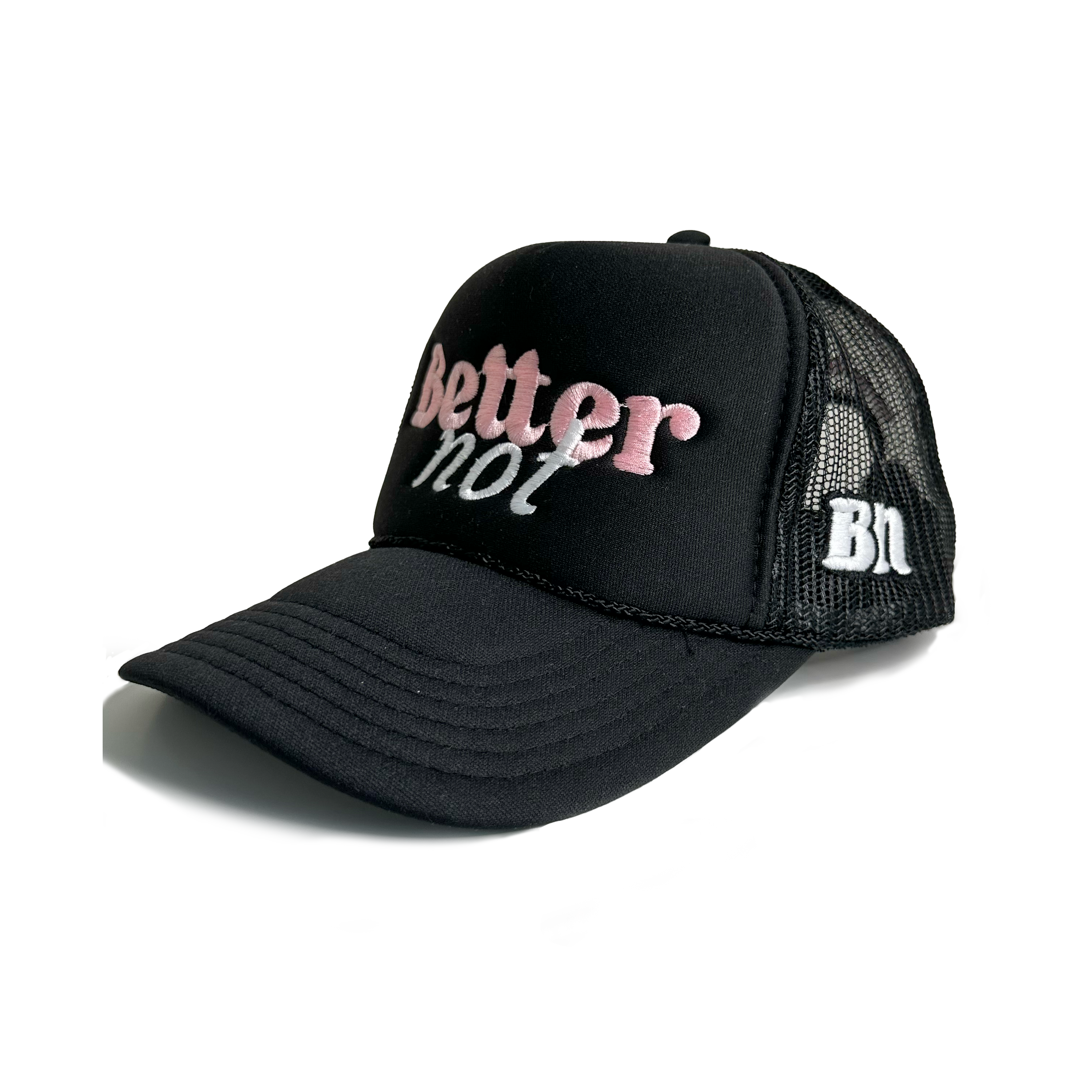 A black "Classic Trucker" cap from Better not, featuring white and pink "better not" embroidery on the front with a Mid Crown fit. The side of the cap displays the initials "BN" in white. It is pictured next to a product tag and is available for next day shipping.