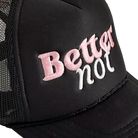 The Classic Trucker cap by Better not features a black mesh-back with "Better not" meticulously embroidered in pink and white on the front panel. This stylish accessory comes with a Mid Crown fit and next day shipping available.