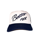 White and navy blue 5-panel hat with The Classic embroidered in cursive on the front.